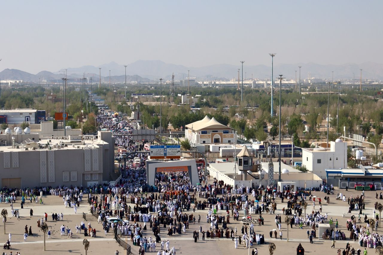 Aerial view of a large gathering at an outdoor marketplace in Mecca.